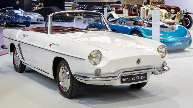 White 1961 Renault Floride roadster right front three-quarter view on display at Retromobile 2017 car show