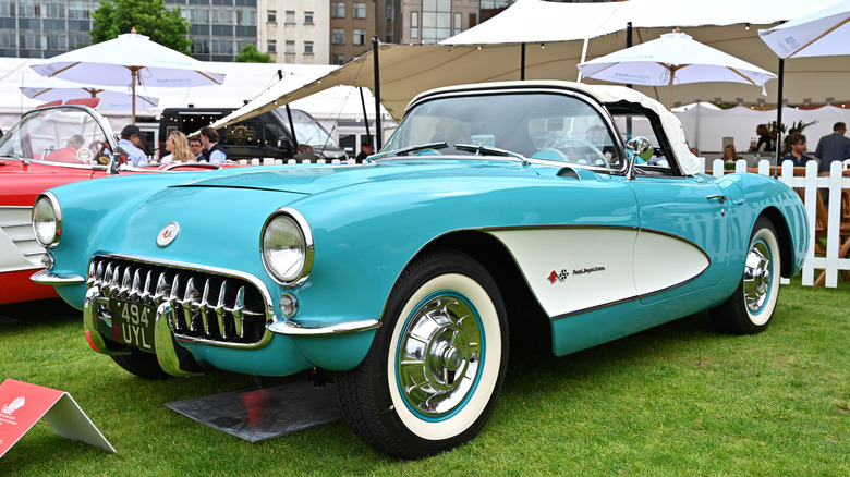 Chevy Corvette parked in the lawn of an auto show.