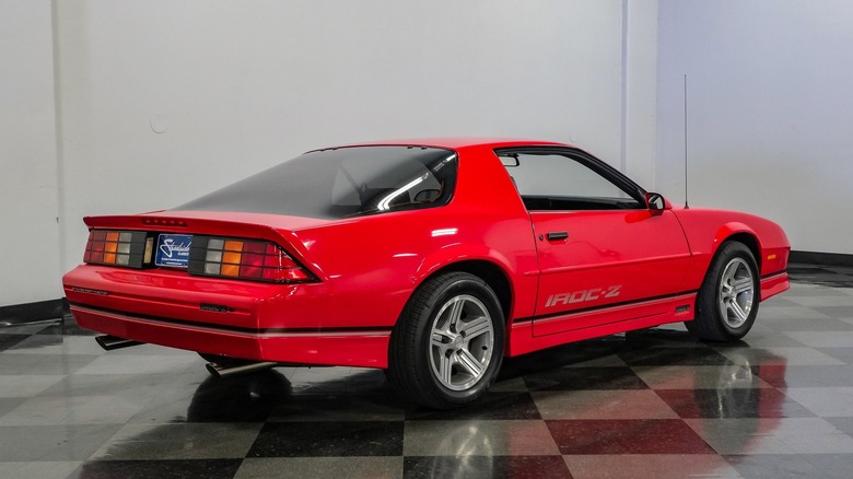 Rear 3/4 of Bright Red 1990 Chevrolet Camaro IROC-Z.