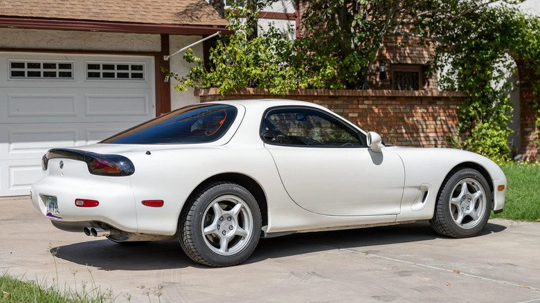 A third-generation Mazda RX-7 shown from the rear quarter in white.