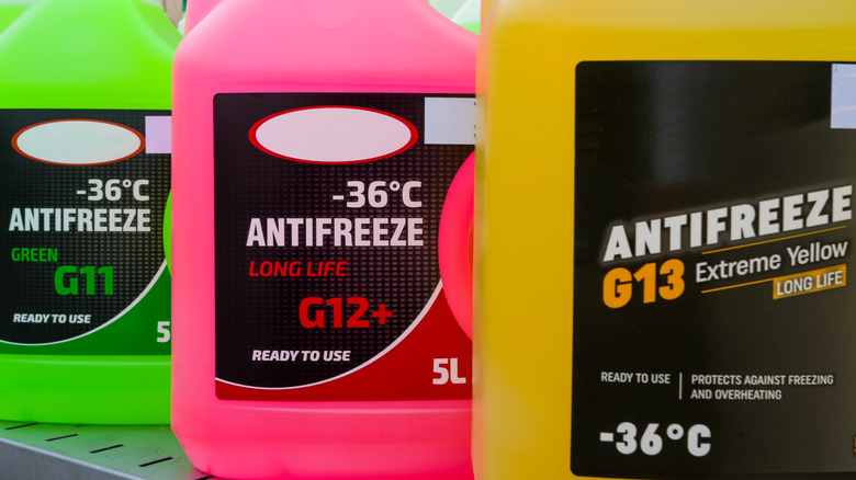 Three bottles of antifreeze in various colors