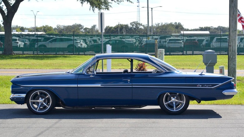 A modified 1961 Chevrolet Impala Bubbletop shows off its side profile