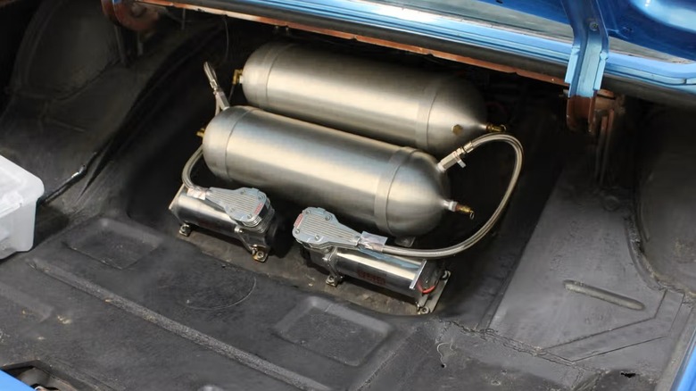A 1961 Ford Thunderbird shows off its air ride suspension system.