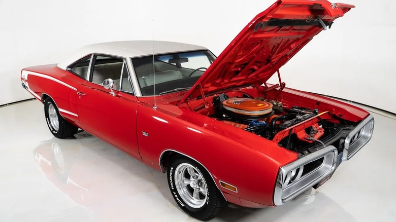 A red 1970 Dodge Super Bee with an open hood