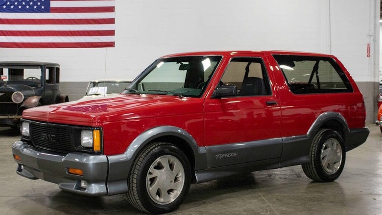 The front 3/4 of the Apple Red 1992 GMC Typhoon for sale.