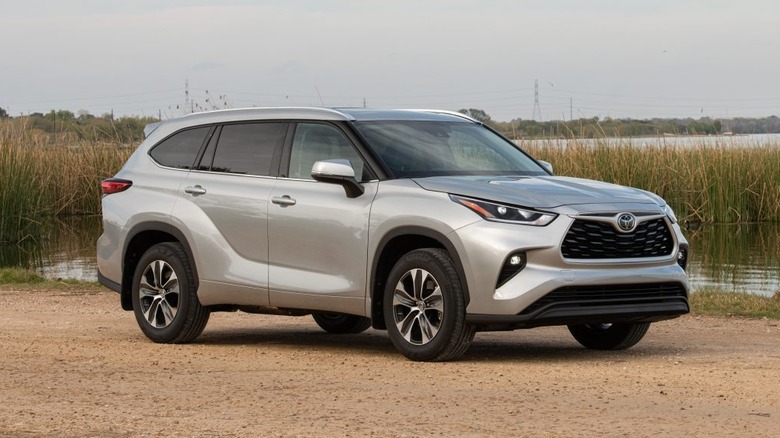 Front quarter view of a 2021 Toyota highlander XSE parked on a riverside.