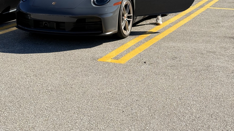 A photo of me stepping into the gray 911