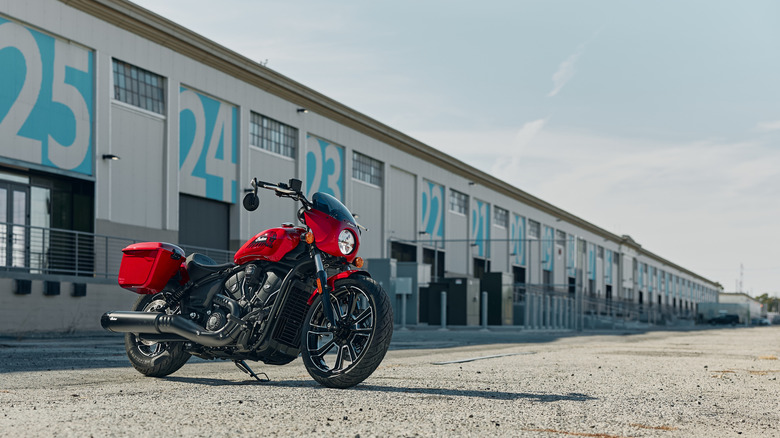 A red bagger motorcycle with compact fairing