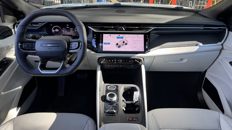 A wide shot of the dashboard in a Cherokee with a white interior