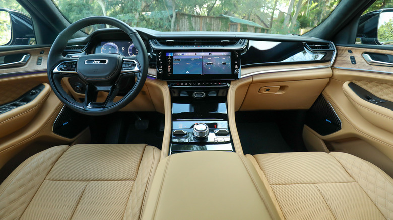 A wide shot of the dashboard inside the new Grand Cherokee with tan leather