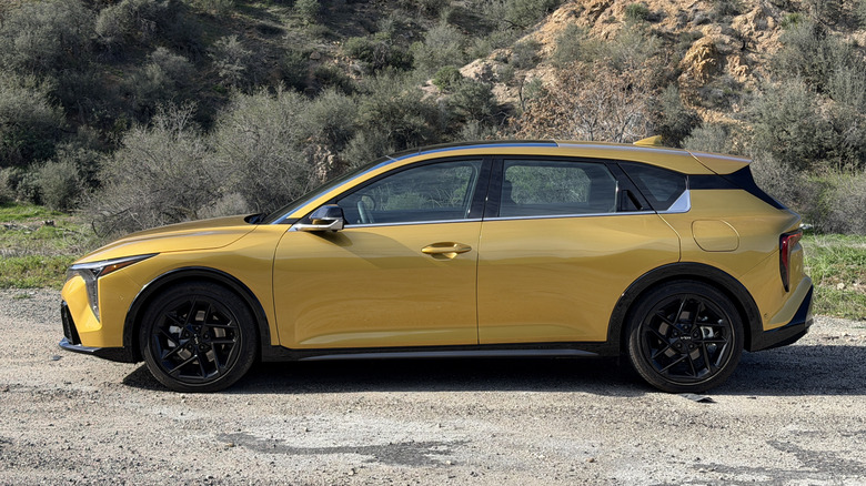 Side view of a yellow 2026 Kia K4 Hatchback