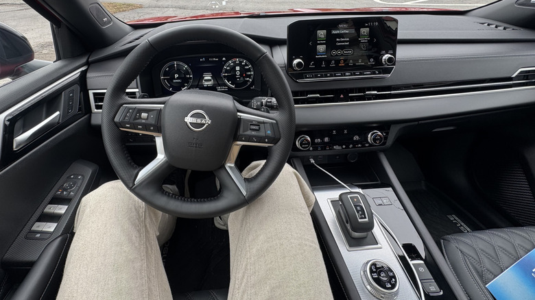 A shot of the driver's POV of the black interior of the Nissan Rogue PHEV