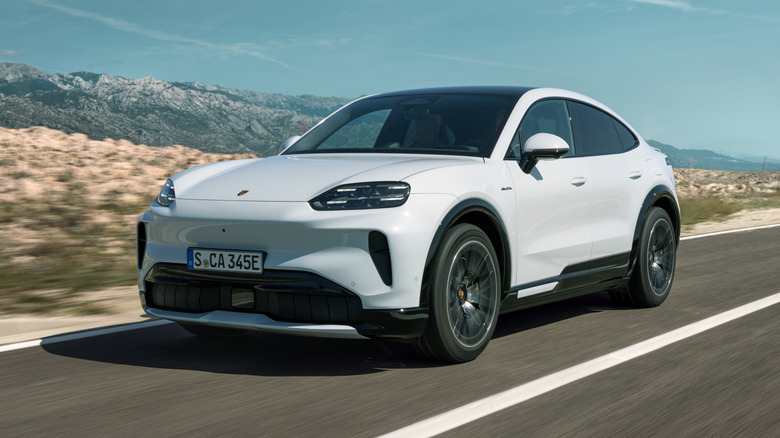 Front 3/4 view of a white Porsche Cayenne Coupe Electric