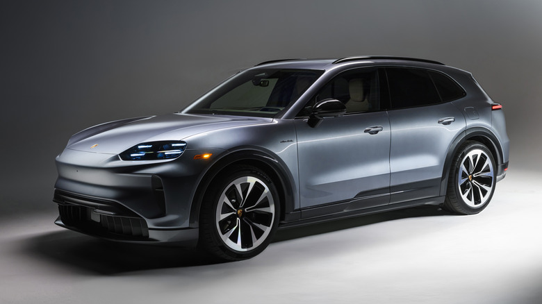 Front 3/4 view of a silver Porsche Cayenne Electric