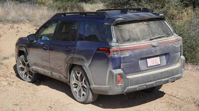 Blue 2026 Subaru Outback rear 3/4 view