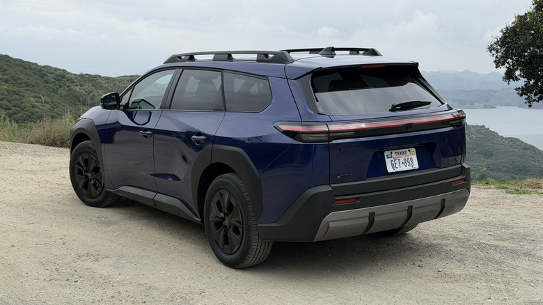 Rear 3/4 view of a blue Toyota bZ Woodland