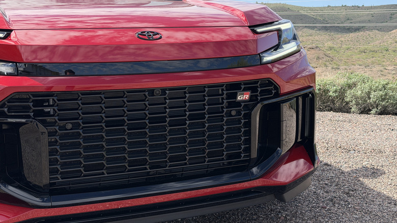 Front grille of a red 2026 Toyota RAV4 GR Sport