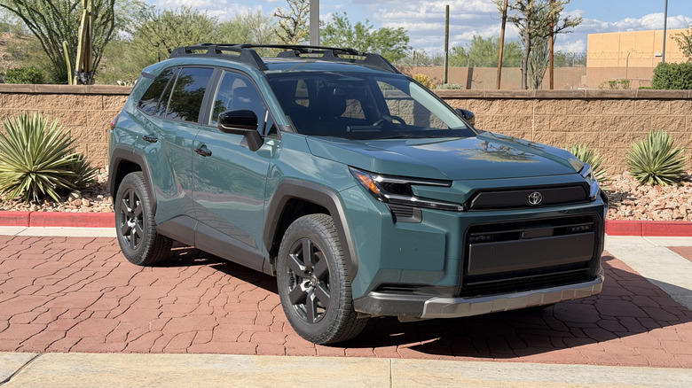 Front 3/4 view of a green 2026 Toyota RAV4 Woodland