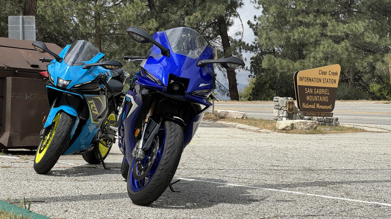 A blue, purple, and yellow Yamaha R7 behind a blue Yamaha R9 on Angeles Crest
