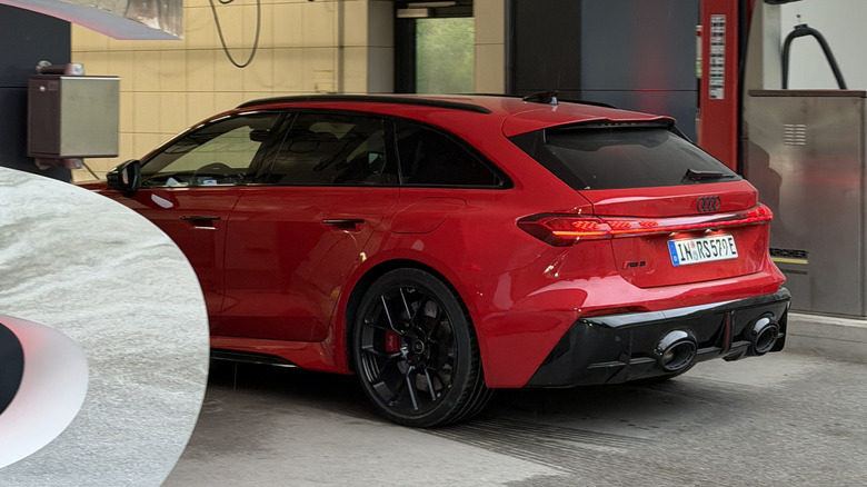 Rear end of a red 2027 Audi RS5 Avant