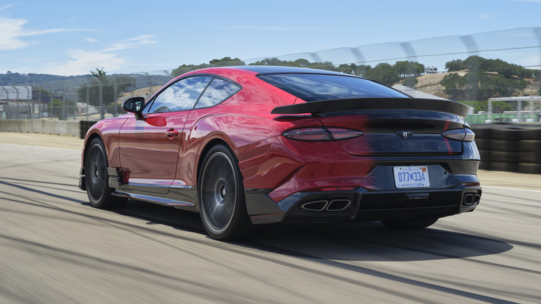 Rear 3/4 view of a red and black Bentley Supersports
