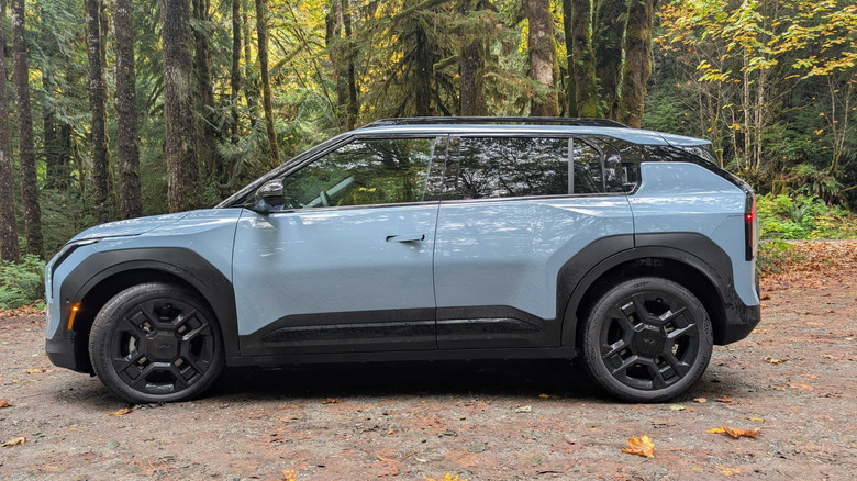 2027 Kia EV3 parked in front of trees