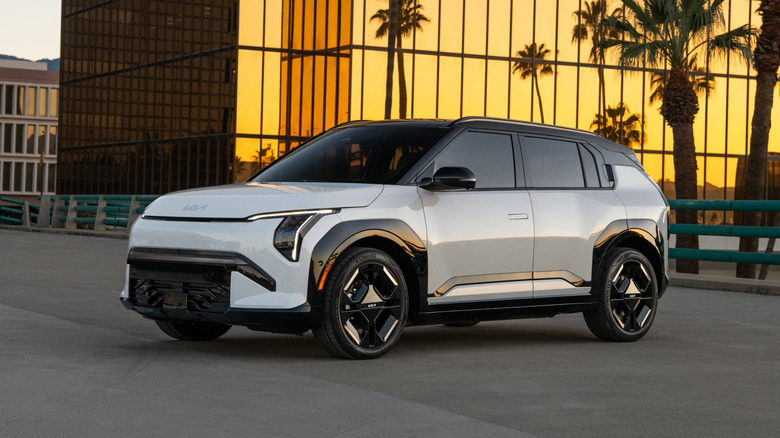 Front 3/4 view of a white Kia EV3.