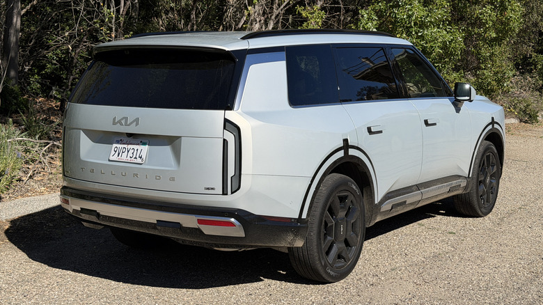 Rear 3/4 view of a silver 2027 Kia Telluride