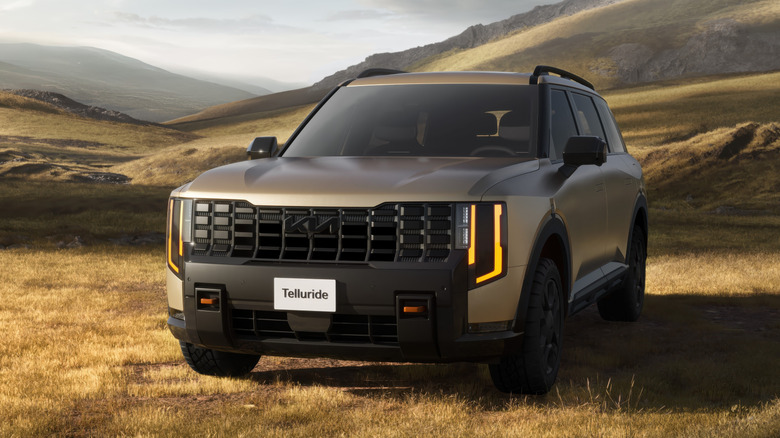 Front 3/4 position of a golden 2027 Kia Telluride X-Pro
