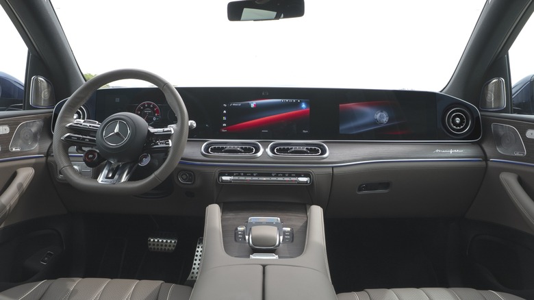 Wide shot of the new GLE's dashboard showing the superscreen and brown interior