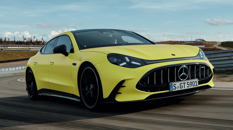 Front 3/4 view of a yellow 2027 Mercedes-AMG GT 4-Door Coupe EV