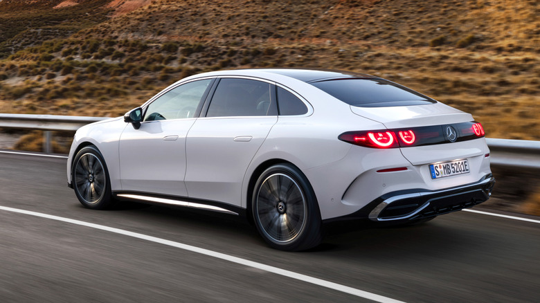 Rear 3/4 view of a white 2027 Mercedes-Benz C-Class EV