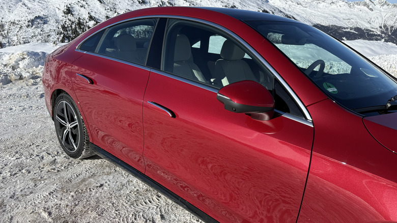 side view of a red 2027 Mercedes-Benz CLA220 4Matic hybrid