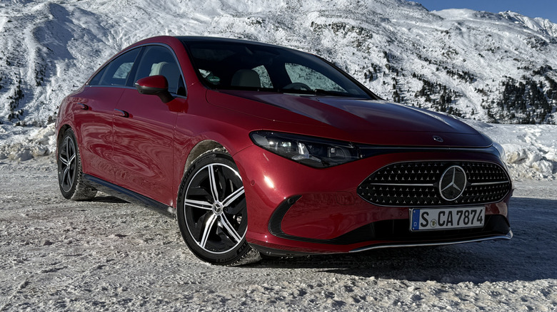 Front 3/4 view of a red 2027 Mercedes-Benz CLA220 4Matic hybrid