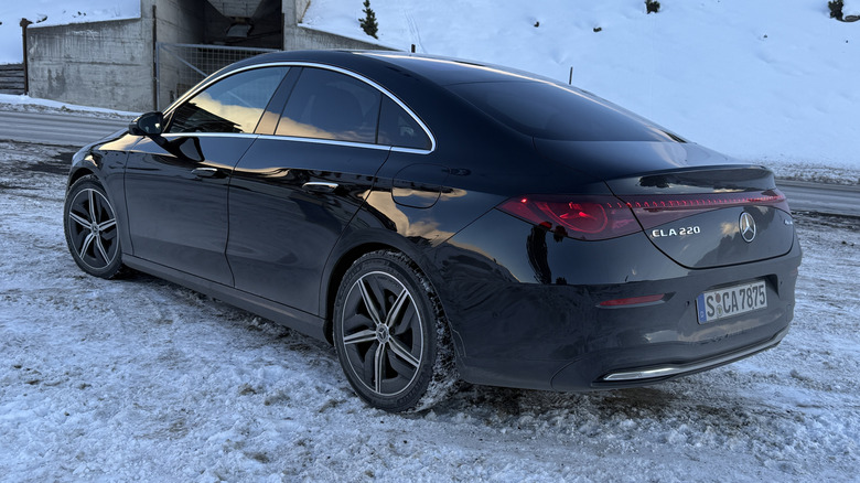rear 3/4 view of a black 2027 Mercedes-Benz CLA220 4Matic hybrid