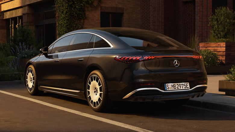 Rear 3/4 view of a black 2027 Mercedes-Benz EQS sedan