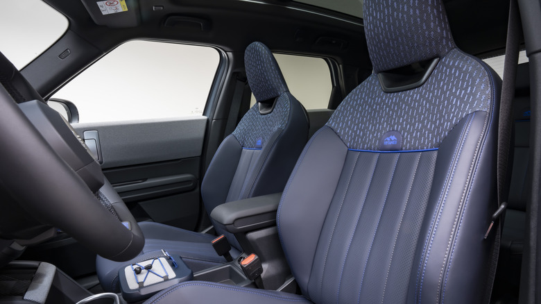 A look back at the blue seats in the Untamed Edition with white walls visible out the windows