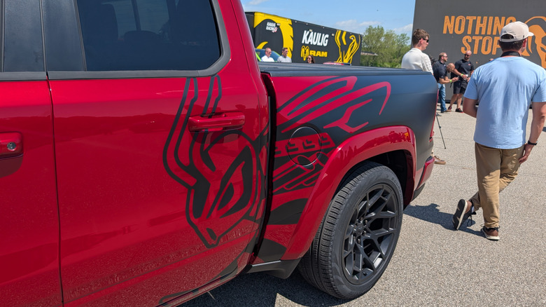 Rumble Bee graphic on the side of a red Ram 1500 Rumble Bee 392 parked on the Chelsea Proving Grounds test track