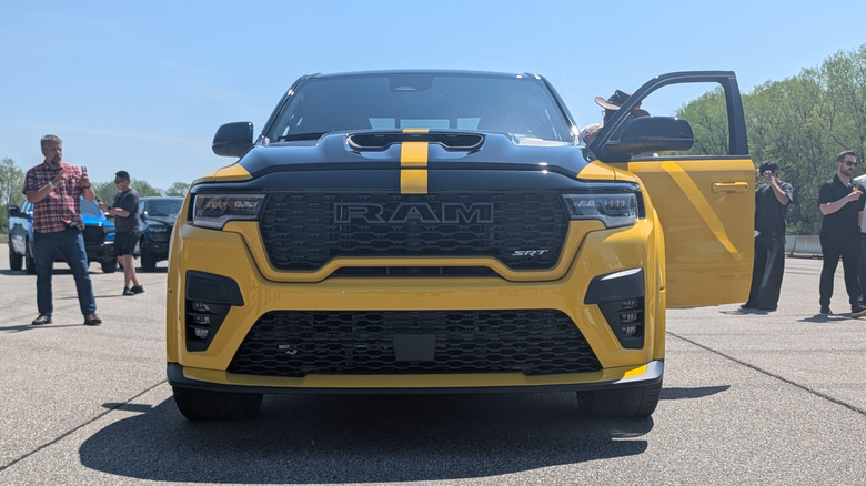 The front of the a bright yellow Ram 1500 Rumble Bee SRT parked on the Chelsea Proving Grounds test track