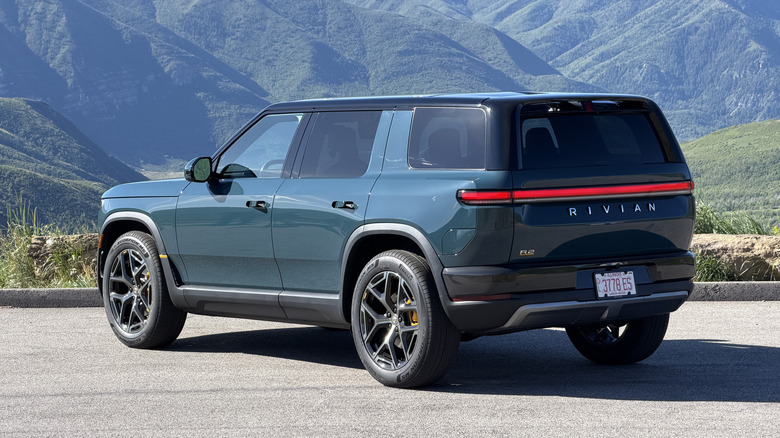 Rear 3/4 view of a blue 2027 Rivian R2