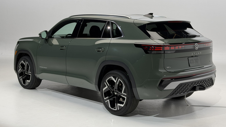 Rear 3/4 view of a green 2027 Volkswagen Atlas Cross Sport