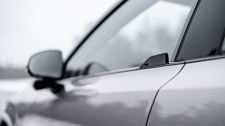 A close-up of a Volvo EX60 wingtip door handle