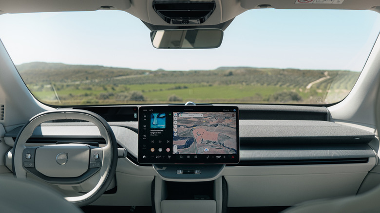 The interior of a 2027 Volvo EX60 with the vineyard on the other side of the windshield