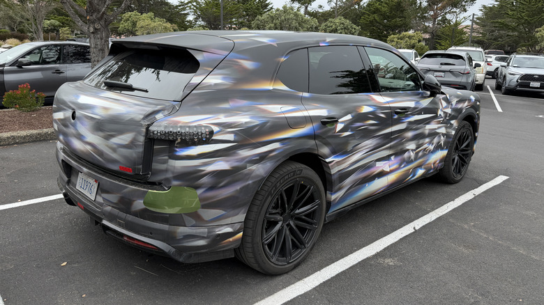 Rear 3/4 view of a camouflaged Bentley Torcal EV prototype