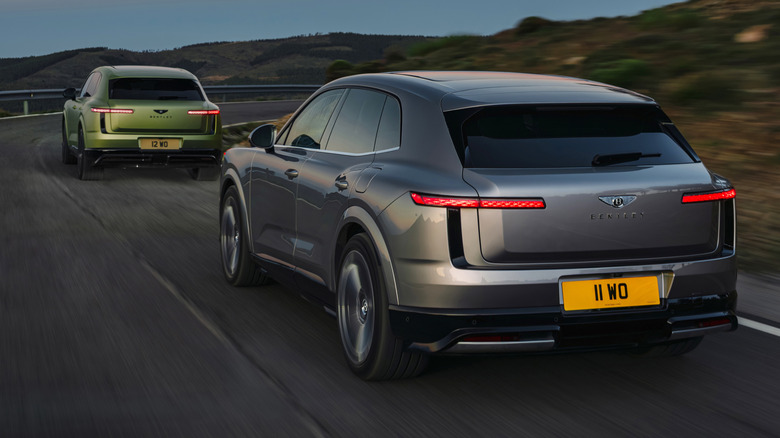 A silver and green Bentley Torcal driving together