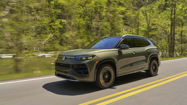 Dynamic shot of a 2026 Avocado Green Volkswagen Tiguan SEL R-Line Turbo.