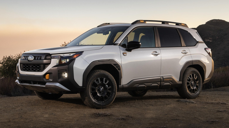 A gray 2026 Subaru Forester Wilderness parked outside at dusk