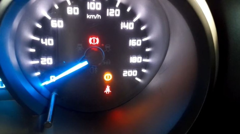 Check-engine and transmission warning lights on a Ford dashboard.