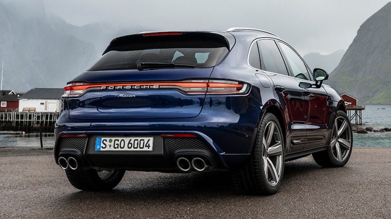 Rear view of a Porsche Macan on a beach