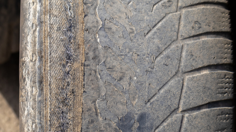 The uneven wear pattern on an old tire